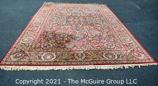 Machine Woven Oriental Rug with Red Ground, Made in Belgium.  Measures 104"L X 96"W.