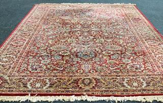 Machine Woven Oriental Rug with Red Ground, Made in Belgium.  Measures 104"L X 96"W.