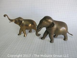 Two brass elephants  (Background scale: 1/4" grid)