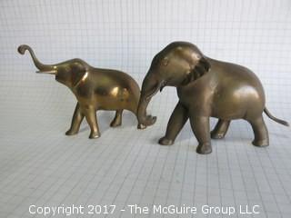 Two brass elephants  (Background scale: 1/4" grid)