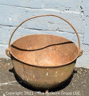 Large Tri-footed Cast Iron Cauldron with Handle.  Drain slot in Base.  Measures 24"D x 14"H.