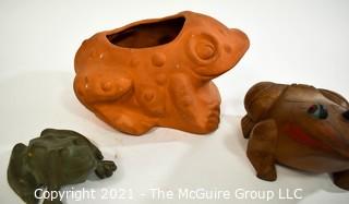 Three (3) Garden Frogs.  Includes Wooden Decorative Box, Iron Door Stop and Ceramic Planter.   Ribbet Ribbet