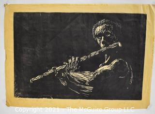 Unframed on Paper Black & White Woodblock Print of Flutist, Signed and Numbered.  Signature Illegible.  Measures 17"W x 26"H.