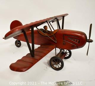 Vintage Red Painted Folk Art Hanging Wooden Biplane with Pilot.  Measures 26"L x  14"T  x 27"W. (TMG Business card placed for size perspective)