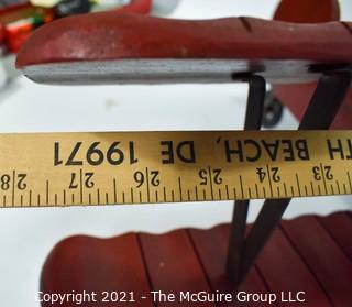 Vintage Red Painted Folk Art Hanging Wooden Biplane with Pilot.  Measures 26"L x  14"T  x 27"W. (TMG Business card placed for size perspective)