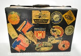 Vintage Fiberglass Drum Case Covered in International Luggage Travel Labels and Tags.  Measures 9" D x 17"W x  24"L.