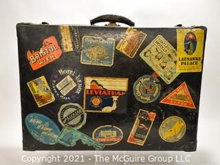 Vintage Fiberglass Drum Case Covered in International Luggage Travel Labels and Tags.  Measures 9" D x 17"W x  24"L.