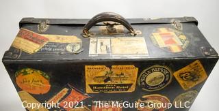 Vintage Fiberglass Drum Case Covered in International Luggage Travel Labels and Tags.  Measures 9" D x 17"W x  24"L.