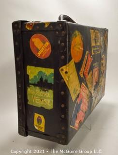 Vintage Fiberglass Drum Case Covered in International Luggage Travel Labels and Tags.  Measures 9" D x 17"W x  24"L.