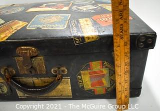 Vintage Fiberglass Drum Case Covered in International Luggage Travel Labels and Tags.  Measures 9" D x 17"W x  24"L.