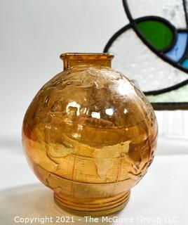 Group of Glass Items Including Stained Glass, Blue Glass Divided Candy Dish with Chrome Cover and Pink Iridescent Globe Piggy Bank.