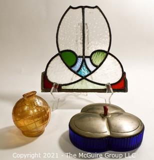 Group of Glass Items Including Stained Glass, Blue Glass Divided Candy Dish with Chrome Cover and Pink Iridescent Globe Piggy Bank.