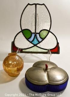 Group of Glass Items Including Stained Glass, Blue Glass Divided Candy Dish with Chrome Cover and Pink Iridescent Globe Piggy Bank.