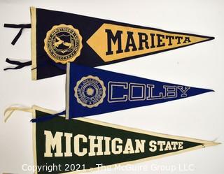 Three (3) Vintage Felt College Pennants - Marietta, Colby & Michigan State University.  Measures 29"L.