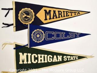 Three (3) Vintage Felt College Pennants - Marietta, Colby & Michigan State University.  Measures 29"L.