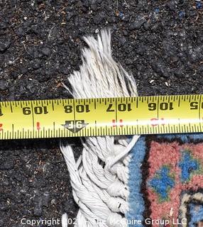 Vintage Hand Knotted Rug with Center Medallion and Border Pattern with Animals on Blue Background.  Measures 107 x 64", with some damage as shown. 