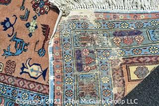 Vintage Hand Knotted Rug with Center Medallion and Border Pattern with Animals on Blue Background.  Measures 107 x 64", with some damage as shown. 