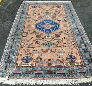 Vintage Hand Knotted Rug with Center Medallion and Border Pattern with Animals on Blue Background.  Measures 107 x 64", with some damage as shown. 