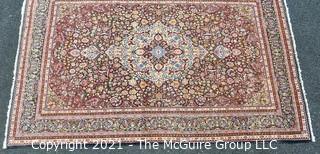 Vintage Hand Knotted Wool Rug with Center Medallion and Border Pattern on Blue Background.  Measures 105" x 71"  