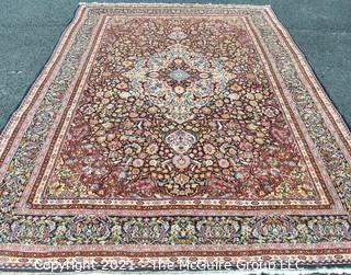 Vintage Hand Knotted Wool Rug with Center Medallion and Border Pattern on Blue Background.  Measures 105" x 71"  