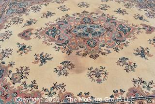 Vintage Wool Rug with Blue Medallion on White Ground.  Has been cleaned, but some discoloraton.  Measures 124" x 94". 
 Measures 124" x 94".