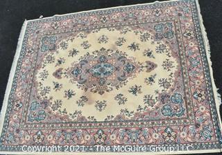 Vintage Wool Rug with Blue Medallion on White Ground.  Has been cleaned, but some discoloraton.  Measures 124" x 94". 
 Measures 124" x 94".