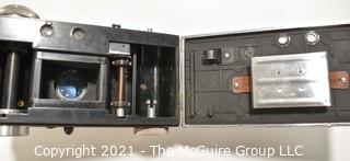Untested Argus C3 35mm Rangefinder Film Camera with Leather Case in Original Box with Paperwork; Polyco Light Meter and Set of Color Correcting Lenses in Case.  Box is in worn condition. 