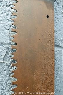 Vintage One Man "Warranted Superior" Crosscut Logging Saw. Measures 49" long.