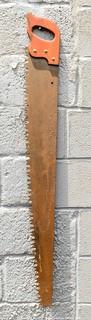 Vintage One Man "Warranted Superior" Crosscut Logging Saw. Measures 49" long.