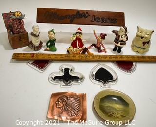 Eclectic Group Including Carved Wood Wrangler Jeans Advertising Counter Top Sign, Porcelain Christmas Elf Figurines, Copper Bas-relief of Native American, Set of Four (4) Bridge Glass Ashtrays & 1940's Puss'n Boots Creamer.