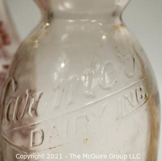 Three (3) Vintage Milk Bottles from Berkley Springs, West Virginia.  One with "The Whip".