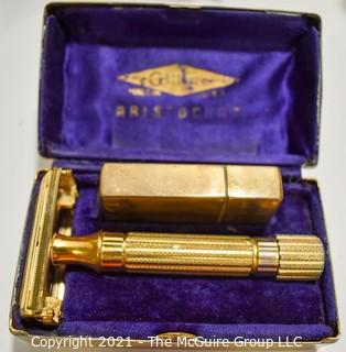 Eclectic Group.  Includes Vintage Gold Gillette Aristocrat Safety Razon in Box, Gold Enamel Painted Flowers by Gloria Vanderbilt, Two (2) Metal Tins & Treasure Bowl Goldfish Bank.