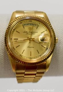 Men's Jules Jurgensen Presidential Day & Date Quartz Watch in Gold Tone Case and Band.