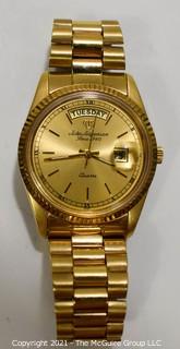 Men's Jules Jurgensen Presidential Day & Date Quartz Watch in Gold Tone Case and Band.