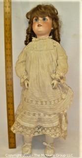 Antique: Doll:  marked "Armand Marselle" German bisque head doll w/ jointed composition body in lace outfit