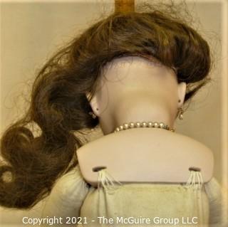 Doll: leather and cloth soft body w/ Simon & Halbig German bisque head and socketed shoulders circa 1912 in blue dress