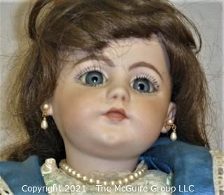 Doll: leather and cloth soft body w/ Simon & Halbig German bisque head and socketed shoulders circa 1912 in blue dress