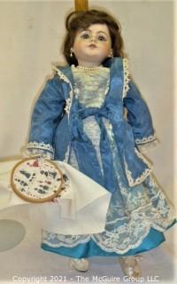 Doll: leather and cloth soft body w/ Simon & Halbig German bisque head and socketed shoulders circa 1912 in blue dress