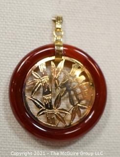 Gold Filled Asian Pendant with Carnelian Stone Surround.  1 1/2" long including bail.