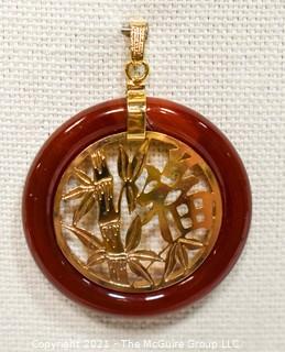 Gold Filled Asian Pendant with Carnelian Stone Surround.  1 1/2" long including bail.