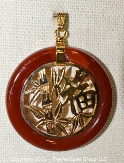 Gold Filled Asian Pendant with Carnelian Stone Surround.  1 1/2" long including bail.