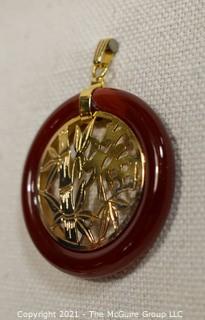 Gold Filled Asian Pendant with Carnelian Stone Surround.  1 1/2" long including bail.