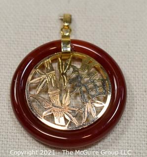 Gold Filled Asian Pendant with Carnelian Stone Surround.  1 1/2" long including bail.