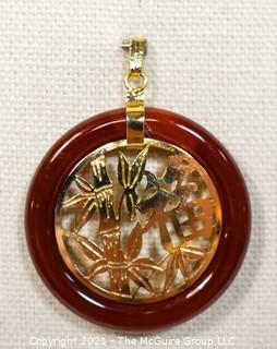 Gold Filled Asian Pendant with Carnelian Stone Surround.  1 1/2" long including bail.