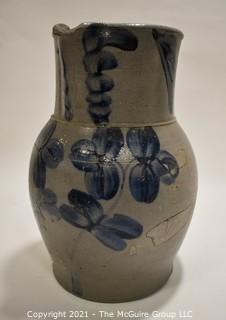 Antique Salt Glazed Stoneware Pottery Crock Pitcher with Hand Painted Cobalt Blue Floral Flower Decoration.  Measures 11" Tall.   (TMG Renumbered)