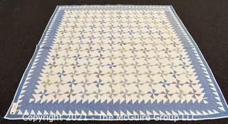 Vintage Hand Made Quilt Signed by Isabella Young in the Pinwheel Pattern in Blue & White.  Some Wear due to age. Measures 72" x 75".