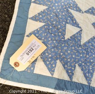 Vintage Hand Made Quilt Signed by Isabella Young in the Pinwheel Pattern in Blue & White.  Some Wear due to age. Measures 72" x 75".