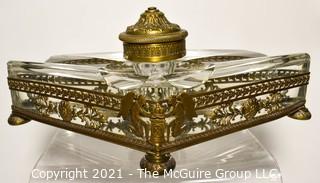 French Revival Crystal Inkwell in Brass Stand with Cherubs. Measures 9" Long.