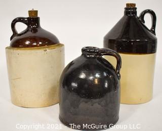 Collection Of Three (3) Primitive Antique Stoneware Utilitarian Crocks or Jugs with Brown Albany Slip Tops. Two Jugs Have Original Corked Tops. 