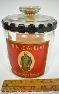 Antique Glass Prince Albert Tobacco Jar or Humidor with Back Label and Metal Locking Strap Around The Lid. Measure 7" T